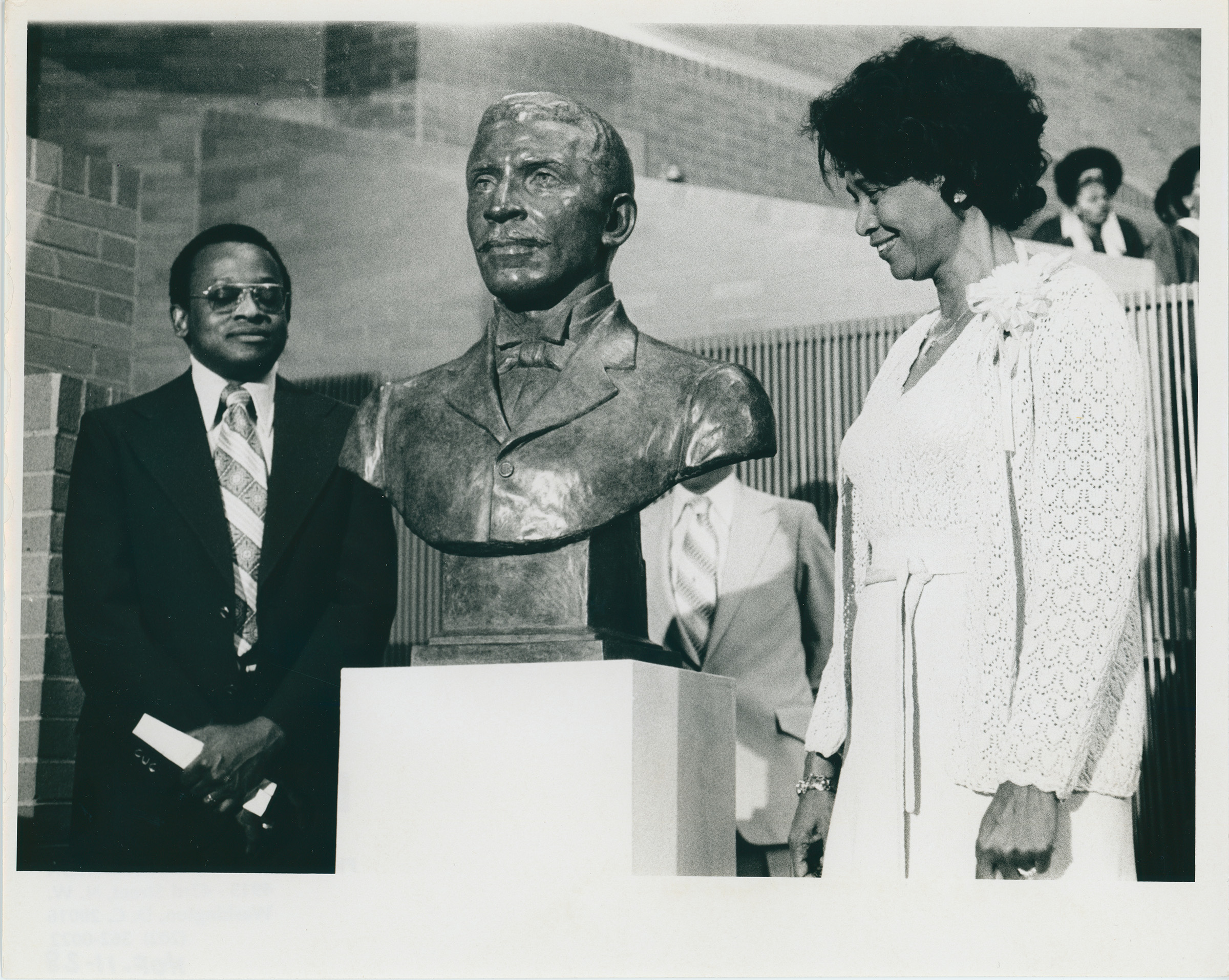 George Washington Carver bust with guests